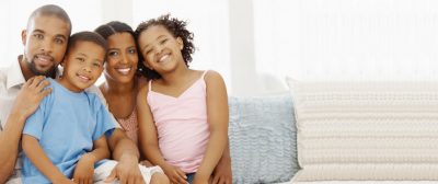 parents with two kids are smiling