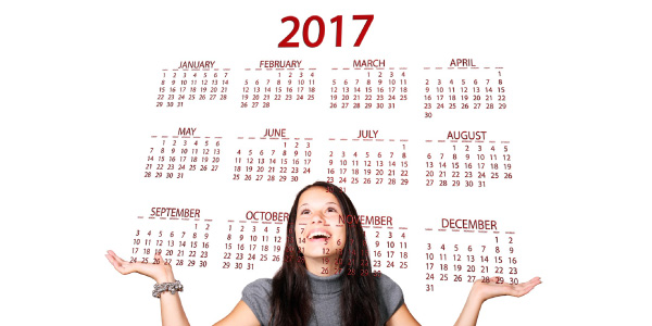 girl looking at 2017 calendars